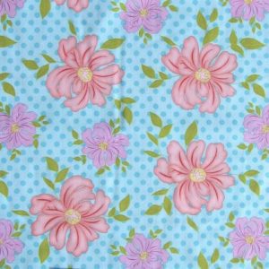 Pink/purple flowers with blue background